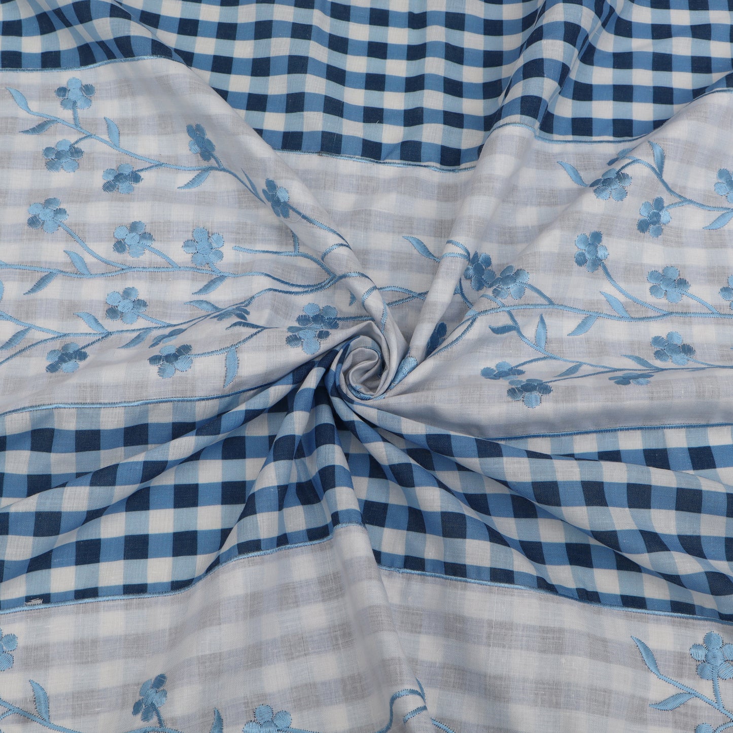 Fabric with blue floral patterns and checkered patterns