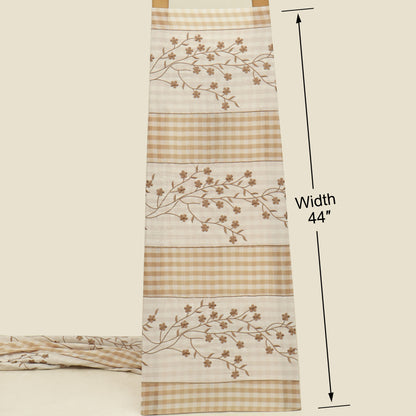 Fabric with floral patterns and checkered design, shown with a measurement label indicating width 44 inches.