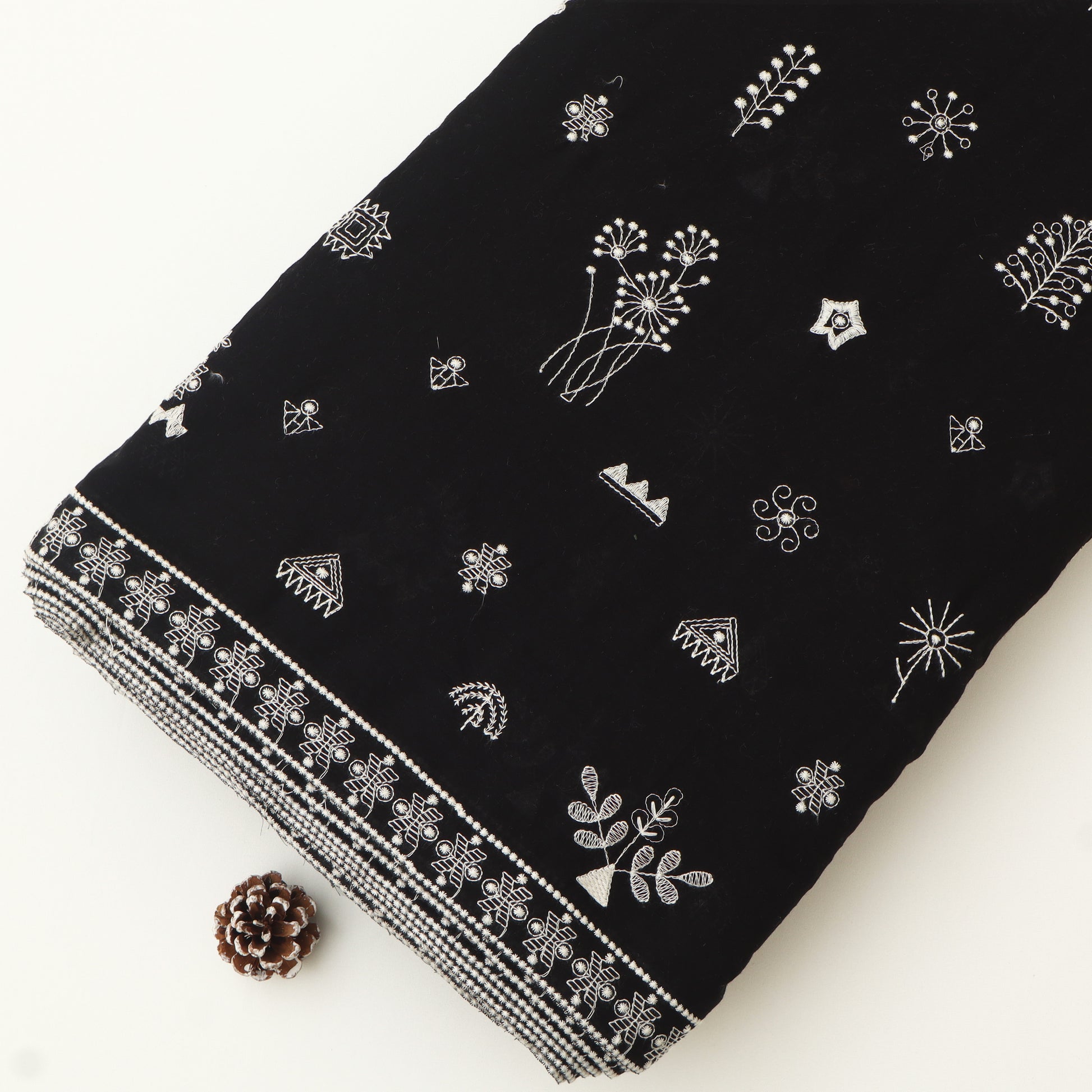 Black  fabric with white patterns on a white background