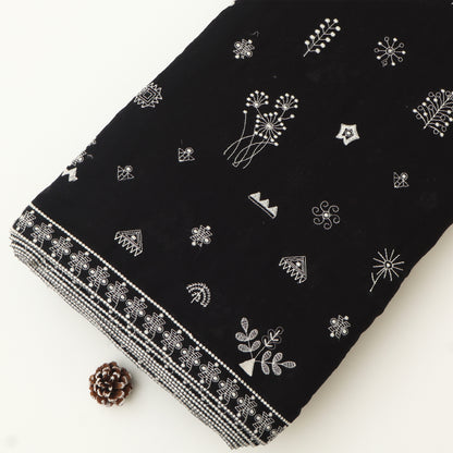 Black  fabric with white patterns on a white background