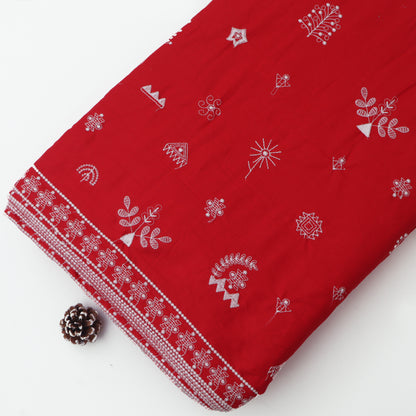 Red fabric with white patterns on a white background