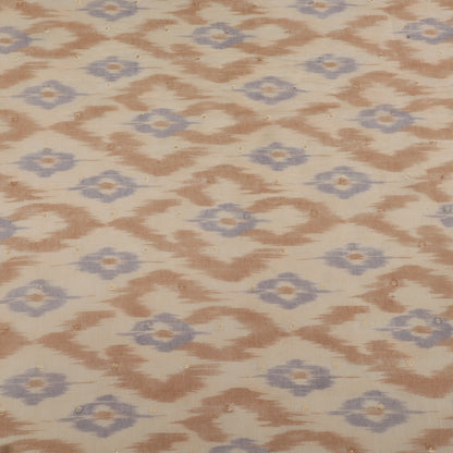 Patterned fabric with brown and blue geometric design on a beige background
