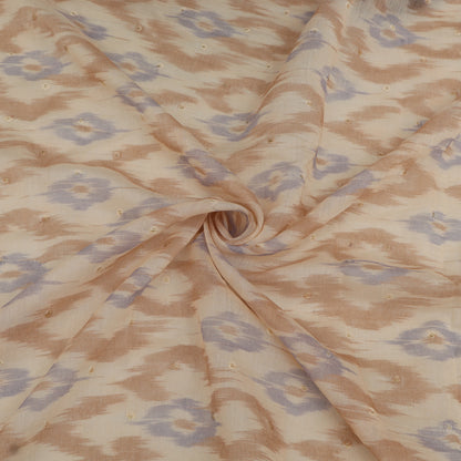 Fabric with a pattern of interlocking shapes in brown and blue on a beige background