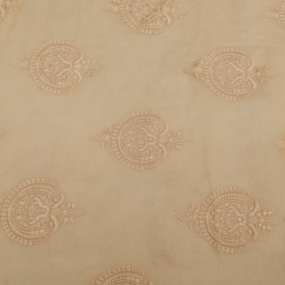 Decorative beige fabric with intricate gold patterns