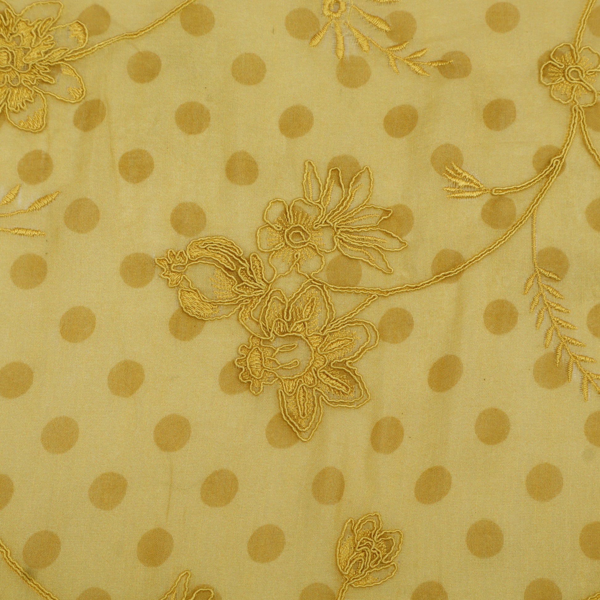 Beige fabric with gold polka dots and floral embroidery