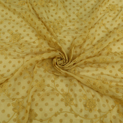 Gold polka dot fabric with intricate patterns