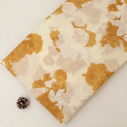 Floral-patterned fabric with gold and beige colors on a white background